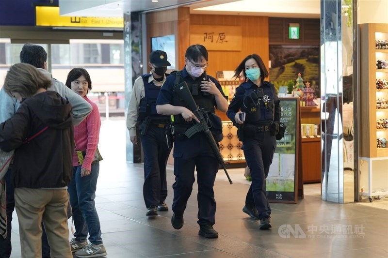 Police officers are armed with heavier firearms for their patrol on the first work day at the Taipei Main Station since the attack on Friday. CNA photo Dec. 22, 2025