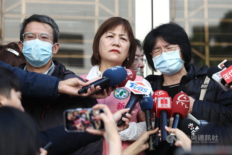 The victim's parents (center left and center right) voice their dissatisfaction with the ruling in an interview outside the Taiwan High Court on Tuesday, accompanied by New Taipei city councilor Shih Yi-yu (center). CNA photo Dec. 23, 2025