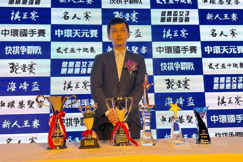 Taiwan's Go ace and Asian Games gold medalist Hsu Hao-hung poses with his trophies at an annual awards ceremony in Taipei on Friday. CNA photo Jan. 9, 2025
