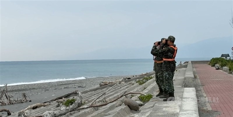 Taiwanese military personnel scan the sea with binoculars along the Taitung County coast on Friday in search of a missing F-16 pilot after the aircraft disappeared on Tuesday. CNA photo Jan. 9, 2025