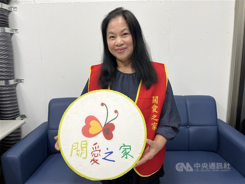 Harmony Home founder Nicole Yang holds a sign featuring her NGO’s logo after an interview at the group’s shelter in Taipei in late January. CNA photo Feb. 5, 2026