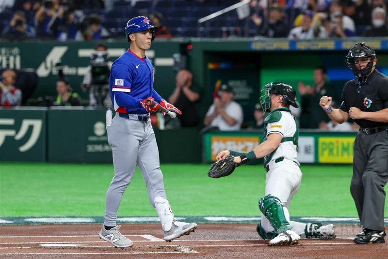 Stuart Fairchild (left) strikes out in the game against Australia at the Tokyo Dome on Thursday. CNA photo March 5, 2026
