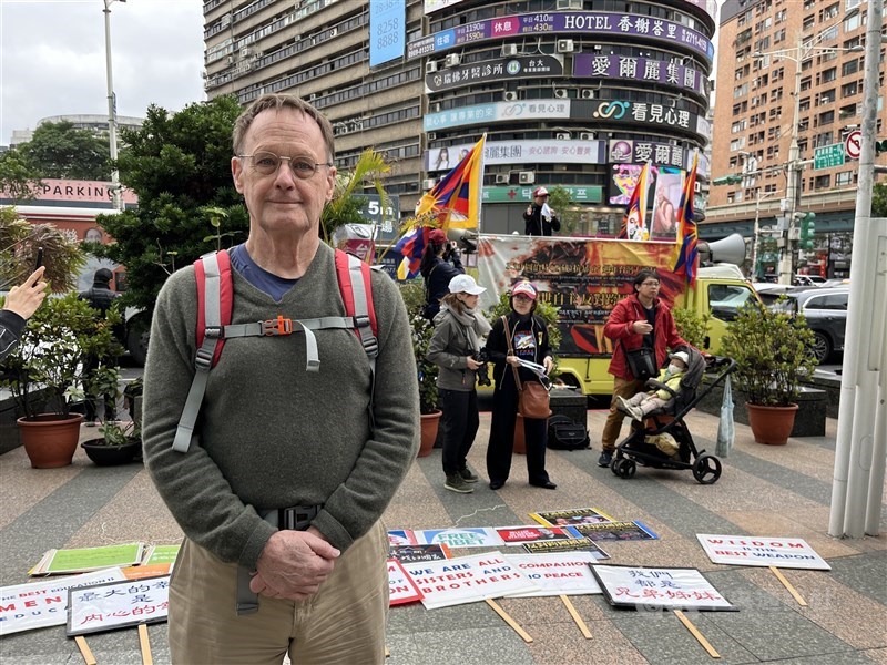 John Isom, a retired lecturer from the University of California, Berkeley, speaks about China’s transnational repression ahead of a march in Taipei on Saturday. CNA photo March 7, 2026