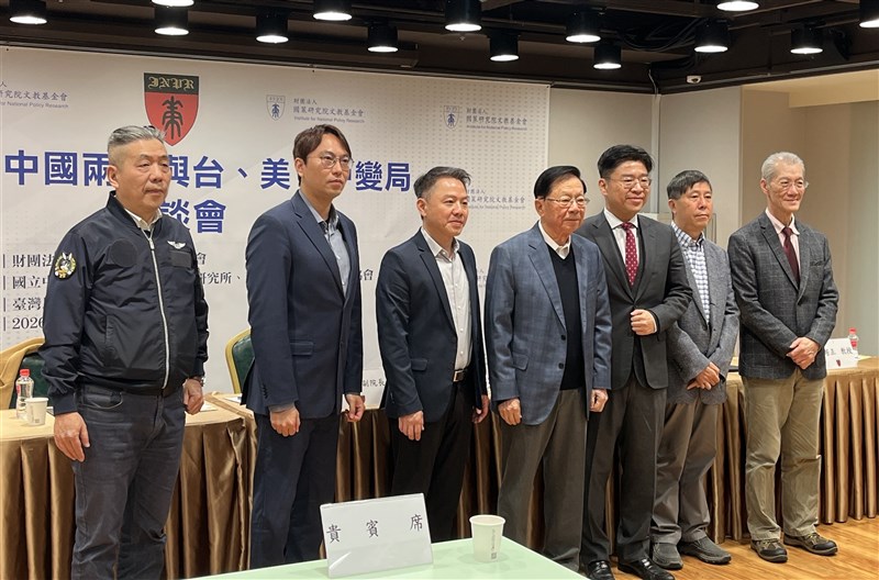 Ming Chu-cheng (first right), an emeritus professor at National Taiwan University, and Ronan Fu (second left), an assistant research fellow at Academia Sinica, pose for a photo before a seminar held by the Institute for National Policy Research in Taipei on Monday. CNA photo March 9, 2026