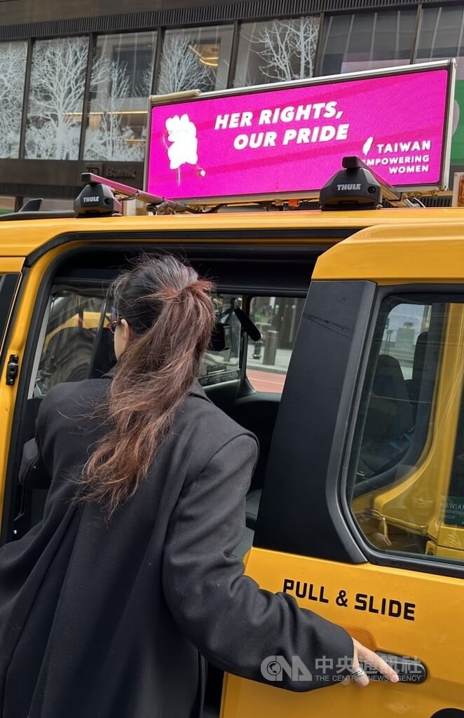 An animated ad campaign which reads "Her rights, Our pride" and "Taiwan, Empowering Women," is displayed atop a yellow taxi during CSW70. CNA photo March 8, 2026