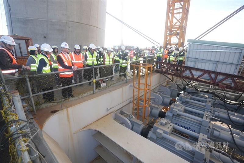 Government officials inspect the damping devices beneath Dajiang Bridge with engineers in January. CNA file photo