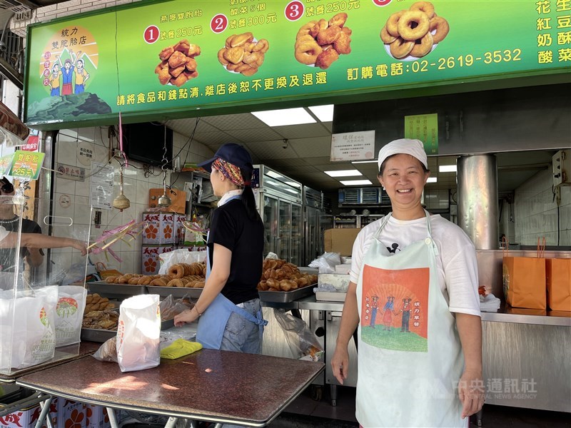 Chang Hsiu-ling (right) at her family-run doughnut shop, which has been in business for more than half a century, on Bali Old Street in early October 2025. CNA photo March 11, 2026