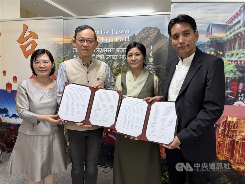 Taiwanese and Tibetan representatives pose for a photo after signing an educational agreement in New Delhi, India, on Wednesday. CNA photo March 26, 2026