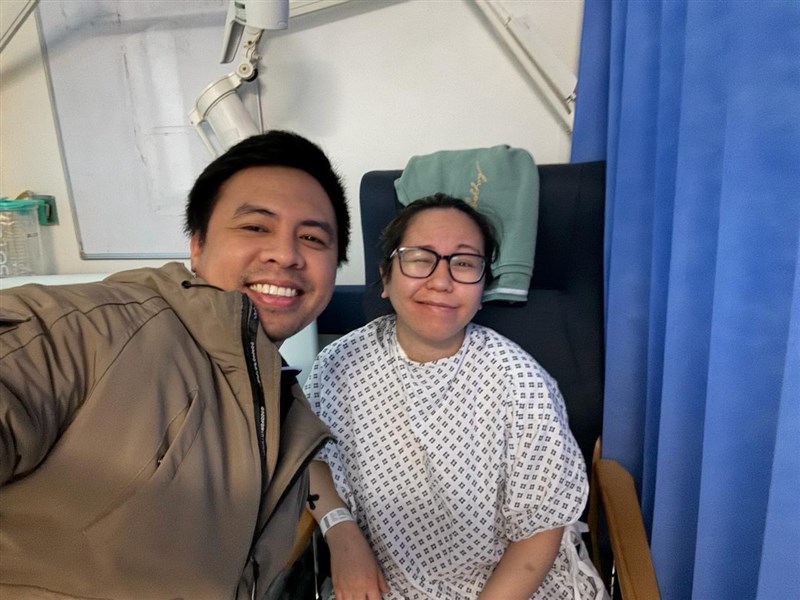 Mark Joseph Radin (left) takes a selfie with Wendilyn Santoalla a few days before her brain surgery at a hospital in the U.K. in March 2024. Photo courtesy of Radin April 3, 2026