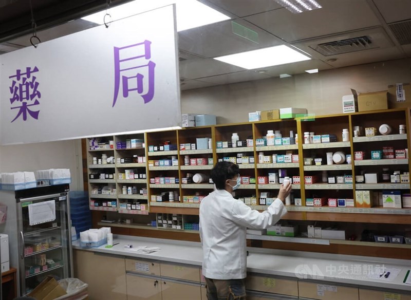 A pharmacist retrieves medication in this CNA file photo for illustrative purposes