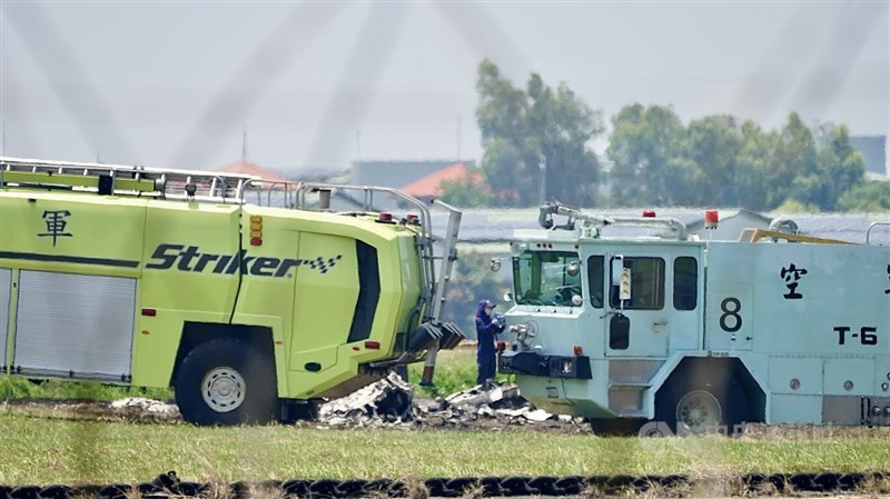 Firetrucks and investigators surround the crash site of an Air Force T-34 trainer aircraft in Kaohsiung on Tuesday. CNA photo June 2, 2026