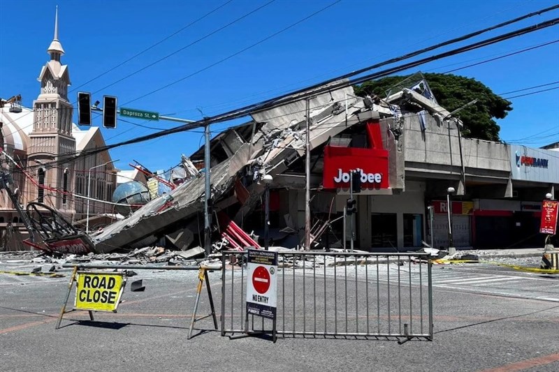 A shopping mall in General Santos City is seen collapsed after a powerful earthquake struck the southern Philippine island of Mindanao on Monday. Photo courtesy of Reuters