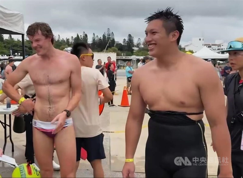 Thomas Gilbert (left) after finishing his 5-km swim on Sunday. CNA photo June 14, 2026
