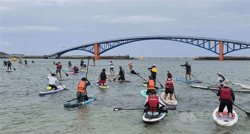 Stand up paddle event participants take off on Sunday. CNA photo June 14, 2026