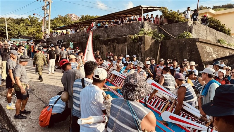 Batanes residents welcome the crew aboard the Ovayan, a traditional Tao wooden plank vessel from Orchid Island, upon its arrival at Batanes in the Philippines on Tuesday. Photo courtesy of Maraos
