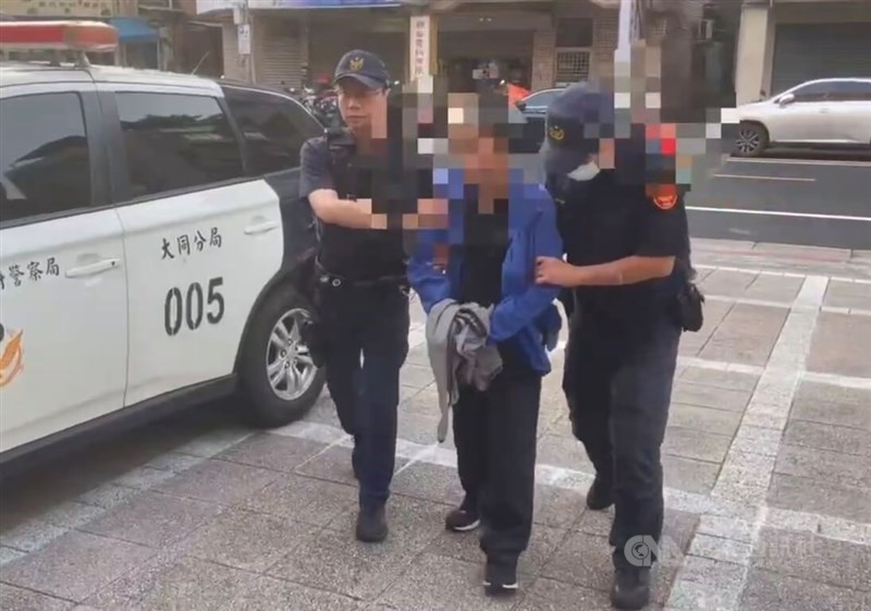 Police escort the suspected attacker in the knife attack case on Saturday. CNA photo June 21, 2026