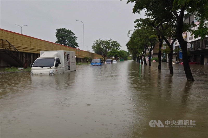 Vehicles sit in floodwater in Tainan's East District on Friday after torrential rain caused widespread flooding across the city. CNA photo June 26, 2026