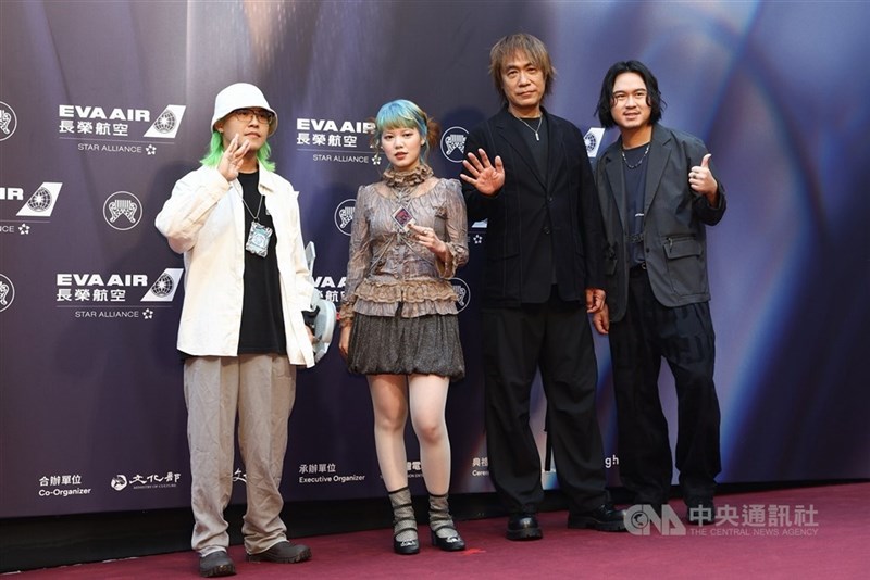 Best Hakka Singer nominee Ana (second left) walks the red carpet with members of her team ahead of the 37th Golden Melody Awards at Taipei Arena on Saturday. The ceremony opened with the traditional pre-show red carpet event as Ana expressed hope of taking home the award. CNA photo June 27, 2026