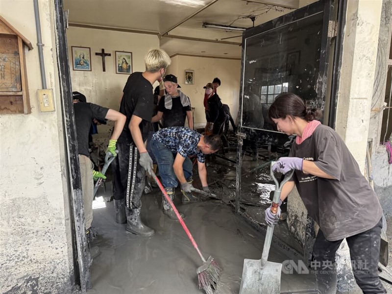 Volunteers clean up the aftermath of the Matai'an barrier lake burst from September 2025. CNA file photo for illustrative purposes