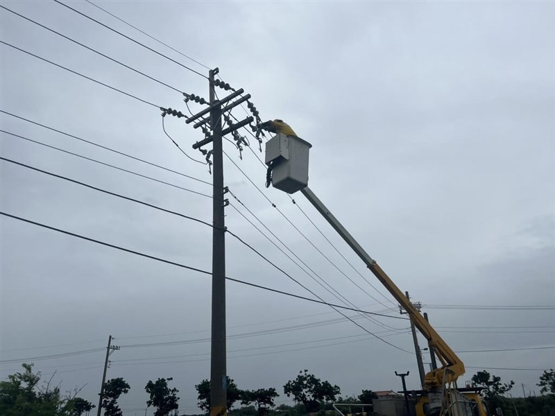 Taiwan Power Co. workers repair damaged power lines using a crane on Saturday. Photo courtesy of Taiwan Power Co. July 11, 2026