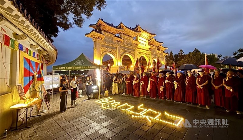 Monks and supporters attend a memorial gathering at Liberty Square in Taipei on Wednesday evening for Tibetan activist Lobga Rangzen. CNA photo July 15, 2026