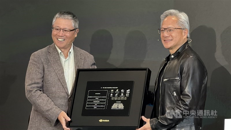 Nvidia Corp. founder and CEO Jensen Huang (right) and Wistron Chairman Simon Lin (left) pose together for a photo during Huang's visit to a manufacturing facility built by Taiwan-based Wistron Corp. in Texas. CNA photo July 22, 2026