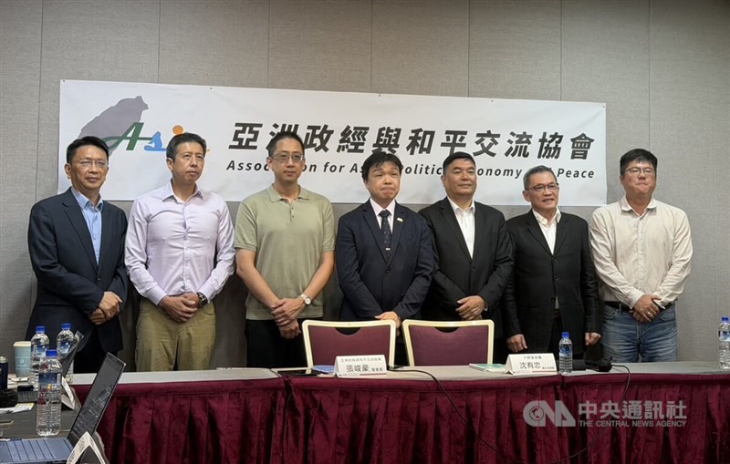 Mainland Affairs Council Deputy Head Shen Yu-chung (fourth left) and Institute for National Defense and Security Research researcher William Chung (second right) pose for a group photo at a seminar in Taipei on Monday. CNA photo July 27, 2026.