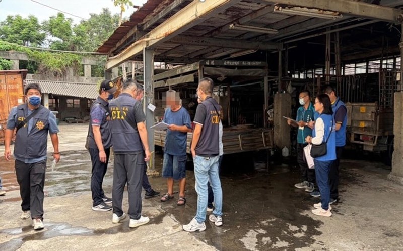 Investigators from the Yunlin District Prosecutors' Office examine documents at at a Yunlin County farm linked to a recent dioxin-contaminated sheep meat case on Saturday. Photo courtesy of Yunlin District Prosecutors' Office