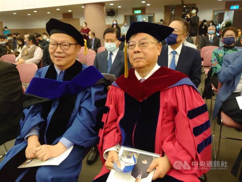 Huang (right) receives an honorary Doctor of Engineering degree from National Yang Ming Chiao Tung University in 2022. CNA file photo