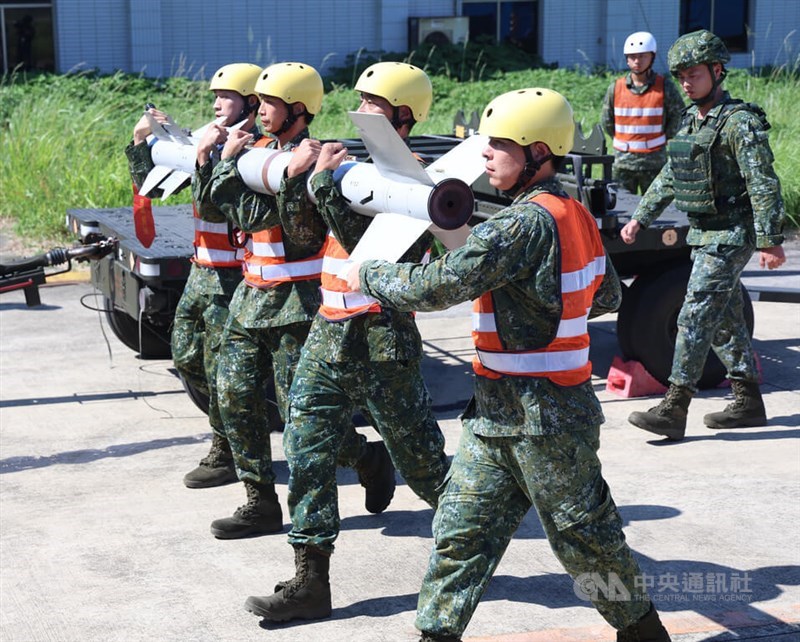 Air Force personnel carry an R.550 Magic air-to-air missile at Hsinchu Air Force Base on Friday during Taiwan's Han Kuang 42 military exercises. CNA photo Aug. 7, 2026