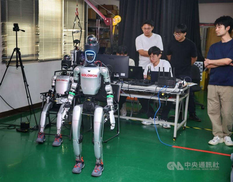 A humanoid robot walks in front of engineers at Solomon Technology Corp., demonstrating its ability to identify and locate 3D objects and navigate independently. CNA photo Aug. 8 , 2026