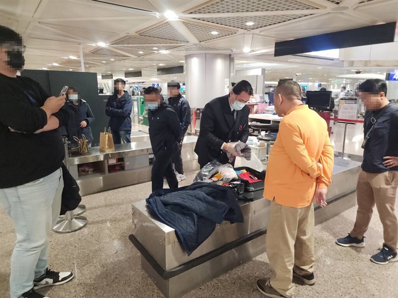 Chen (in orange), one of the alleged drug mules who allegedly traveled to Cambodia and Myanmar to smuggle heroin into Taiwan in a cross-border drug trafficking network led by a former Winter Olympian surnamed Wu. Photo courtesy of Yunlin District Prosecutors' Office