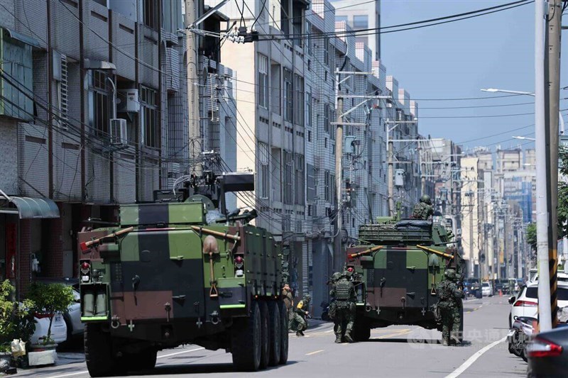 Armored vehicles advance alongside infantry during the Fifth Combat Theater Command's key-point defense drill on Thursday, part of the annual Han Kuang military exercises in central Taiwan. CNA photo Aug. 13, 2026