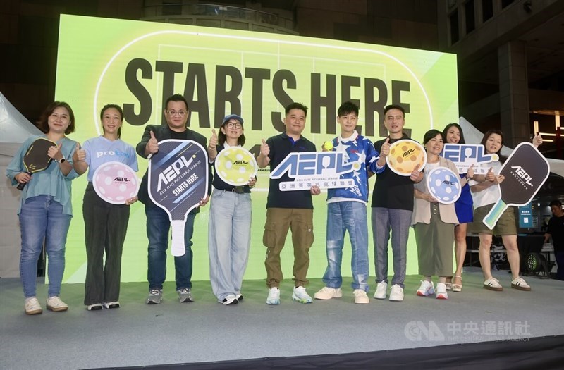 Entertainer Jimmy Lin (fifth right), the Asia Elite Pickleball League's tournament ambassador, poses with league representatives on stage at a press conference in Taipei on Monday ahead of the league's inaugural season. CNA photo Aug. 17, 2026