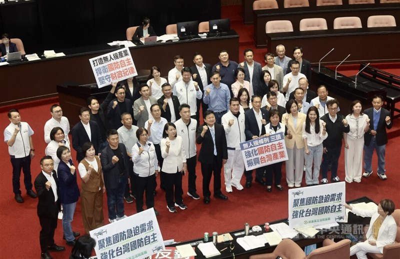 Kuomintang lawmakers call for "stronger defense autonomy" and "industrial revitalization" inside the Legislative Yuan in Taipei on Thursday as the legislature passes the Act on Strengthening Defense Autonomy and Developing the Unmanned Vehicles Industry. CNA photo Aug. 27, 2026