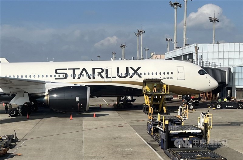A Starlux plane sits at a boarding gate at Taoyuan International Airport. CNA file photo