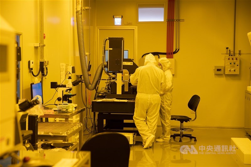 Technicians operate equipment at a semiconductor plant. CNA file photo