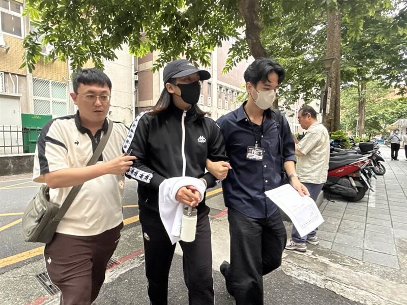 One of Kao Chin Su-mei’s aides, surnamed Chen (center), leaves after questioning in Taipei on Wednesday. CNA photo Sept. 9, 2026