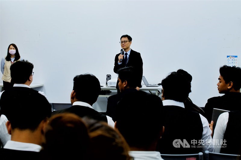 Huang Wei-cheng (standing), deputy director of the Ministry of Labor's Cross-Border Workforce Recruitment Center, delivers a welcome speech. CNA photo Sept. 14, 2026