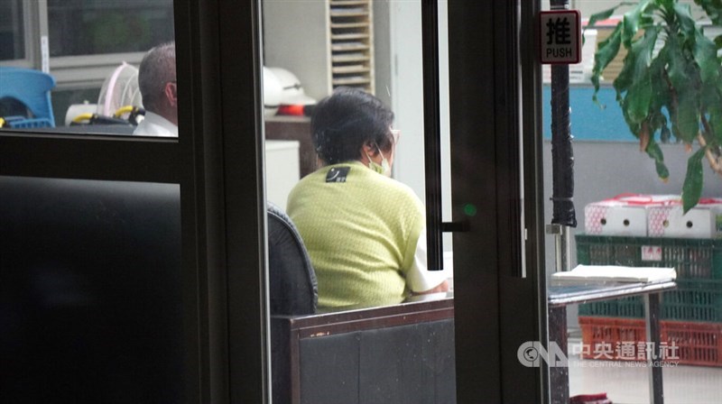 Hsieh's mother, Cheng Ju-fen (in green shirt), waits for bail to be posted at the court. CNA photo Sept. 18, 2026