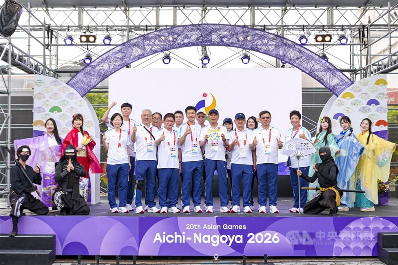 Taiwan's Sports Minister Lee Yang (center) poses with Taiwan delegates in the opening flag-raising ceremony of the 2026 Aichi-Nagoya Asian Games in Japan on Friday.  CNA photo Sept. 18, 2026
