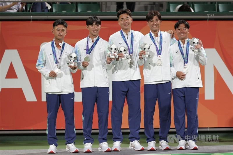 Members of Taiwan's men's soft tennis team at the 2026 Aichi-Nagoya Asian Games pose together for a photo after their silver-medal win. CNA photo Sept. 20, 2026