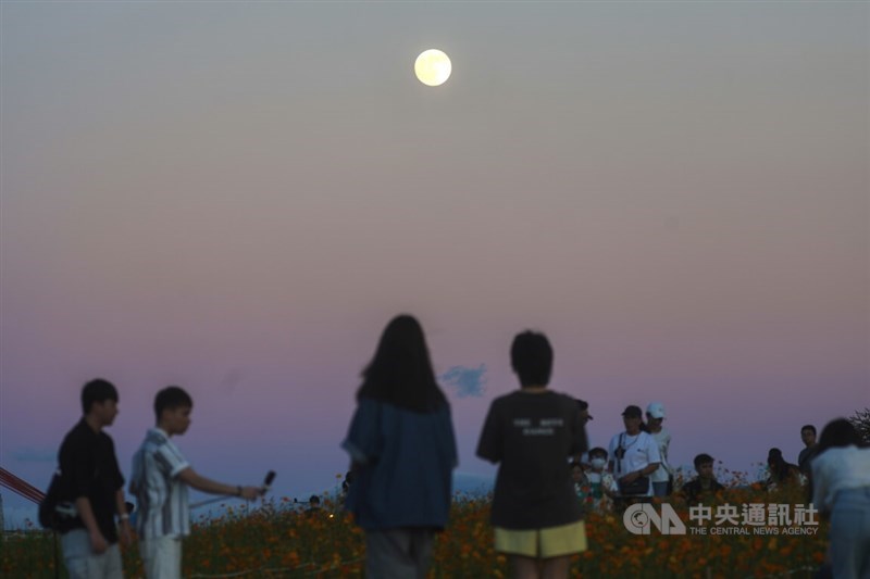 Members of the public enjoy moon gazing in this CNA file photo