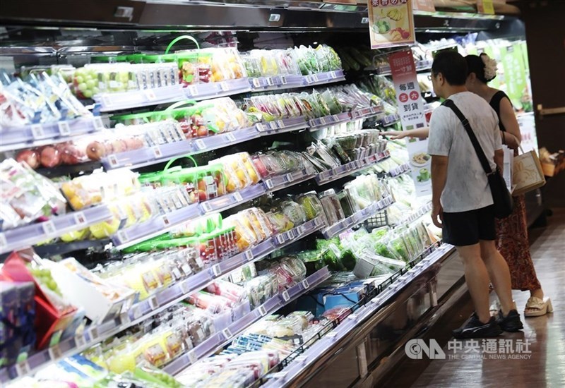 Two people browse items sold at a supermarket. CNA file photo