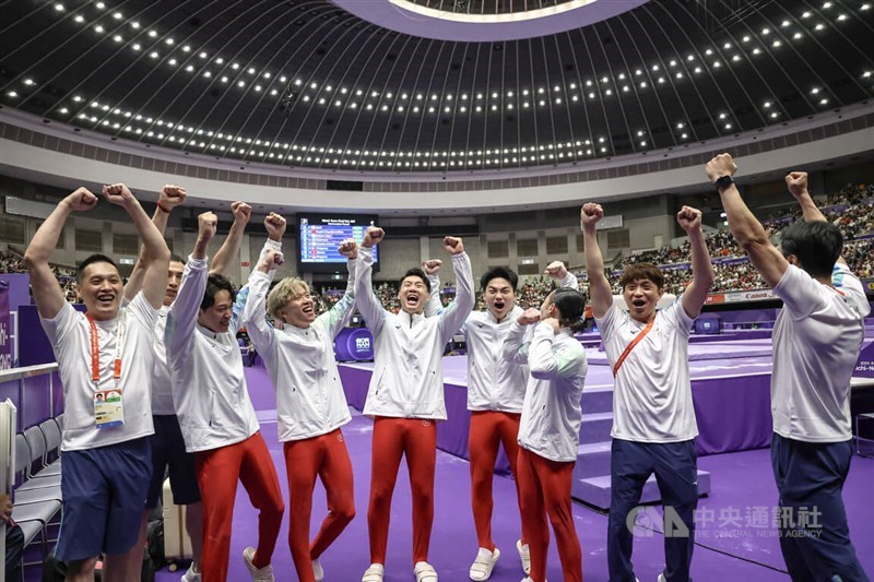 Taiwan’s men’s artistic gymnastics team members cheer on the podium after winning the bronze medal with a total score of 239.896 points at the Asian Games on Wednesday. In the front row, from second left, are Shiao Yu-jan, Li Chih-kai, and Tang Chia-hung, alongside Hung Yuan-hsi and Chuang Chia-lung. CNA photo Sept. 23, 2026