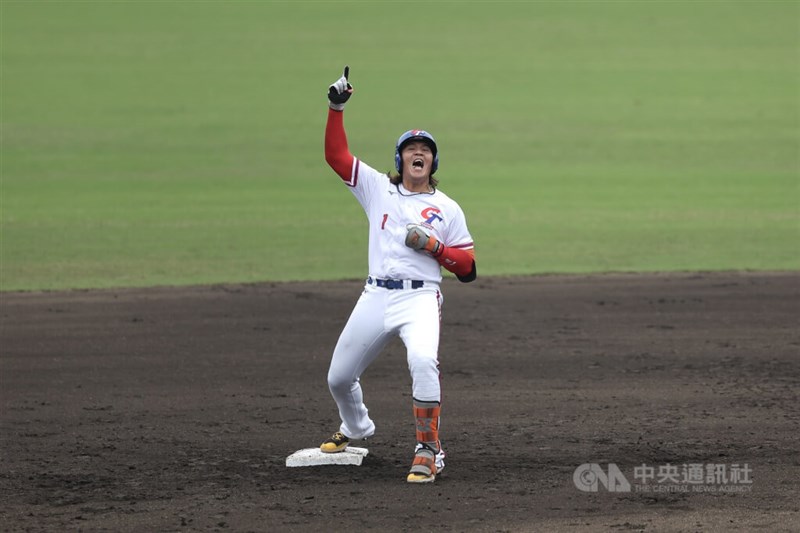 Taiwan's Chen Min-shih raises his arms in celebration after hitting a two-run double to extend Taiwan's lead to 4-0 in the seventh inning against China at the 2026 Aichi-Nagoya Asian Games on Sunday. CNA photo Sept. 27, 2026