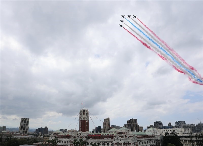 The Air Force’s Thunder Tiger aerobatic team performs a flyby trailing red, blue and white smoke. CNA photo Oct. 10, 2026