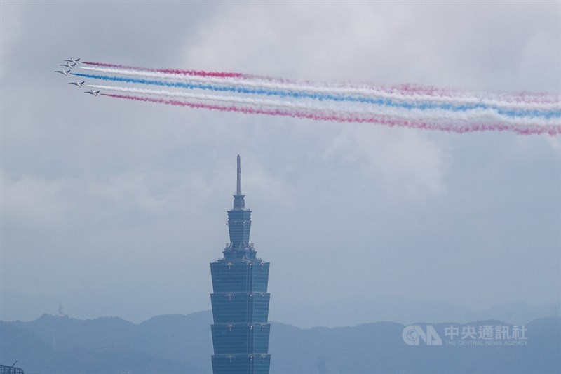 The Air Force’s Thunder Tiger aerobatic team performs a flyby trailing red, blue and white smoke. CNA photo Oct. 10, 2026