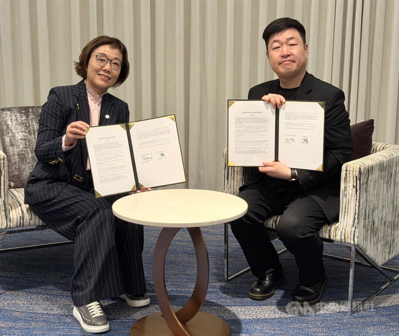 TAICCA Chairperson Sue Wang (left) and B.A. Entertainment CEO Jang Won-seok pose after signing the memorandum of understanding during the Busan International Film Festival on Monday. CNA photo Oct. 12, 2026