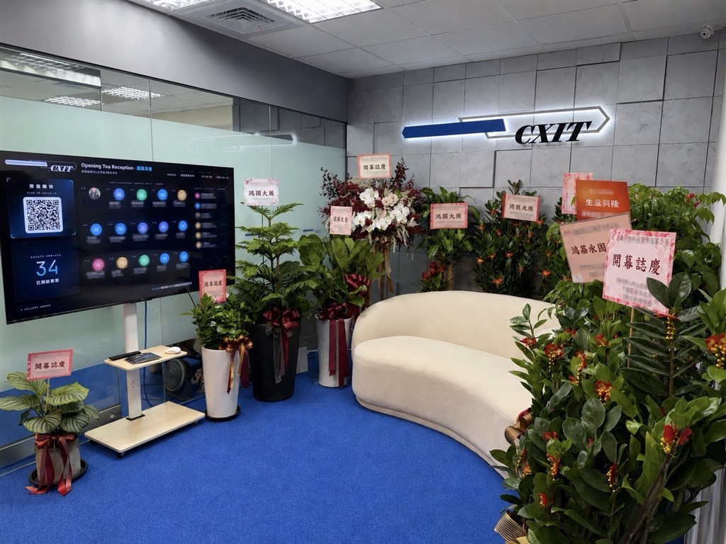 Congratulatory floral arrangements from corporate partners celebrate the grand opening of CXIT’s global headquarters.